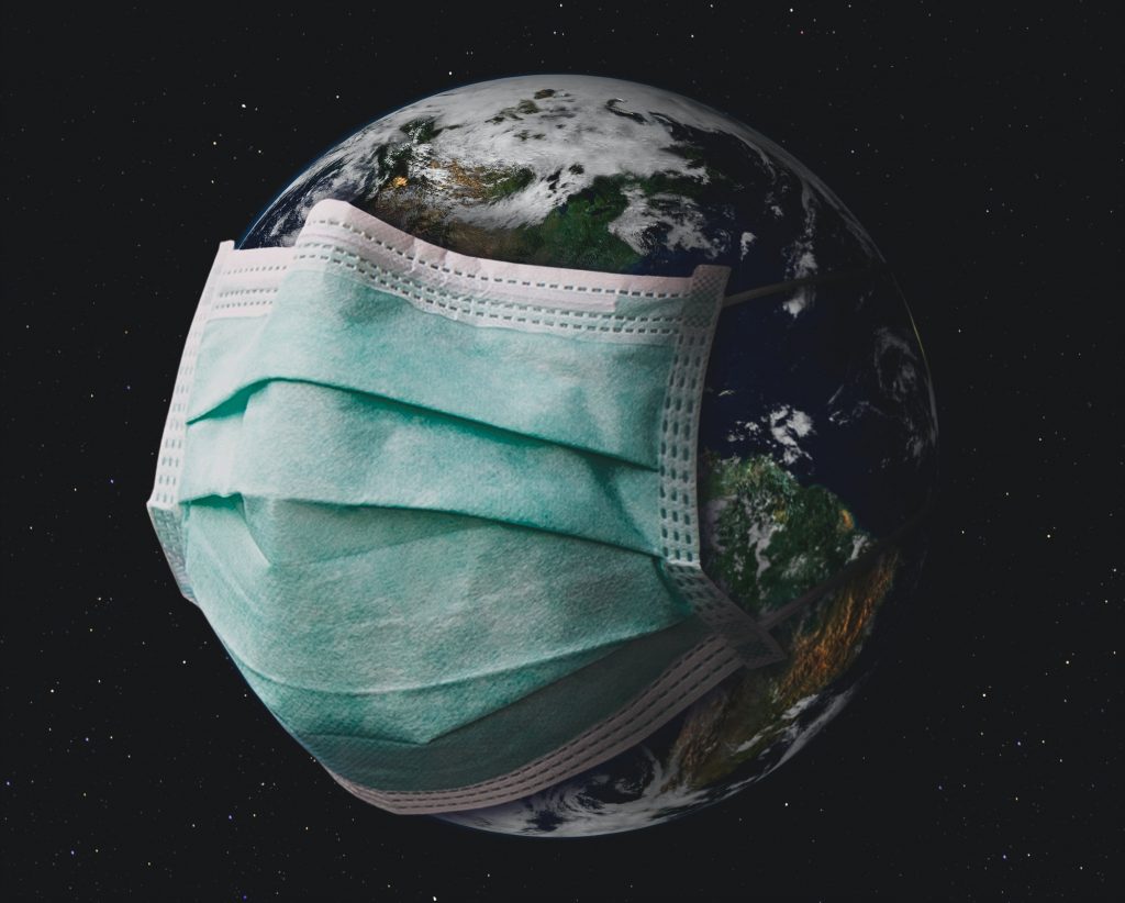 Planet earth with surgical mask.