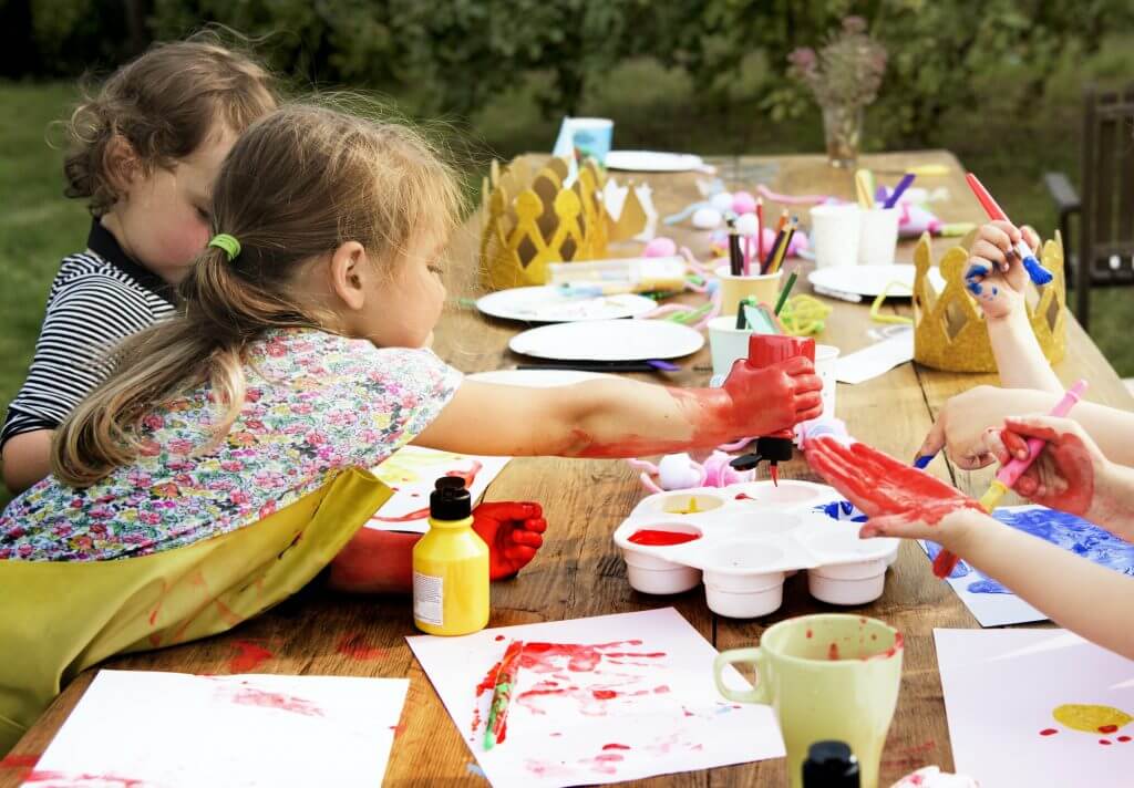 Group of young kids enjoying artworks